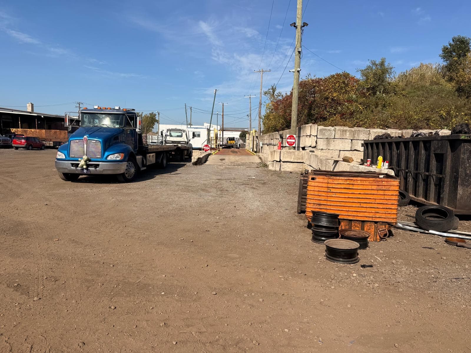 Flatbed tow truck ready for a pickup at the yard